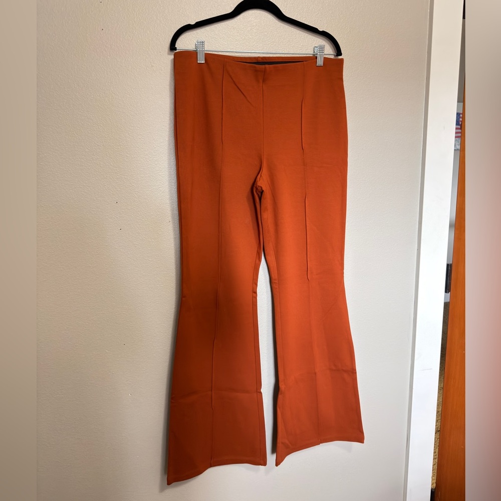 Stretchy orange flared pants